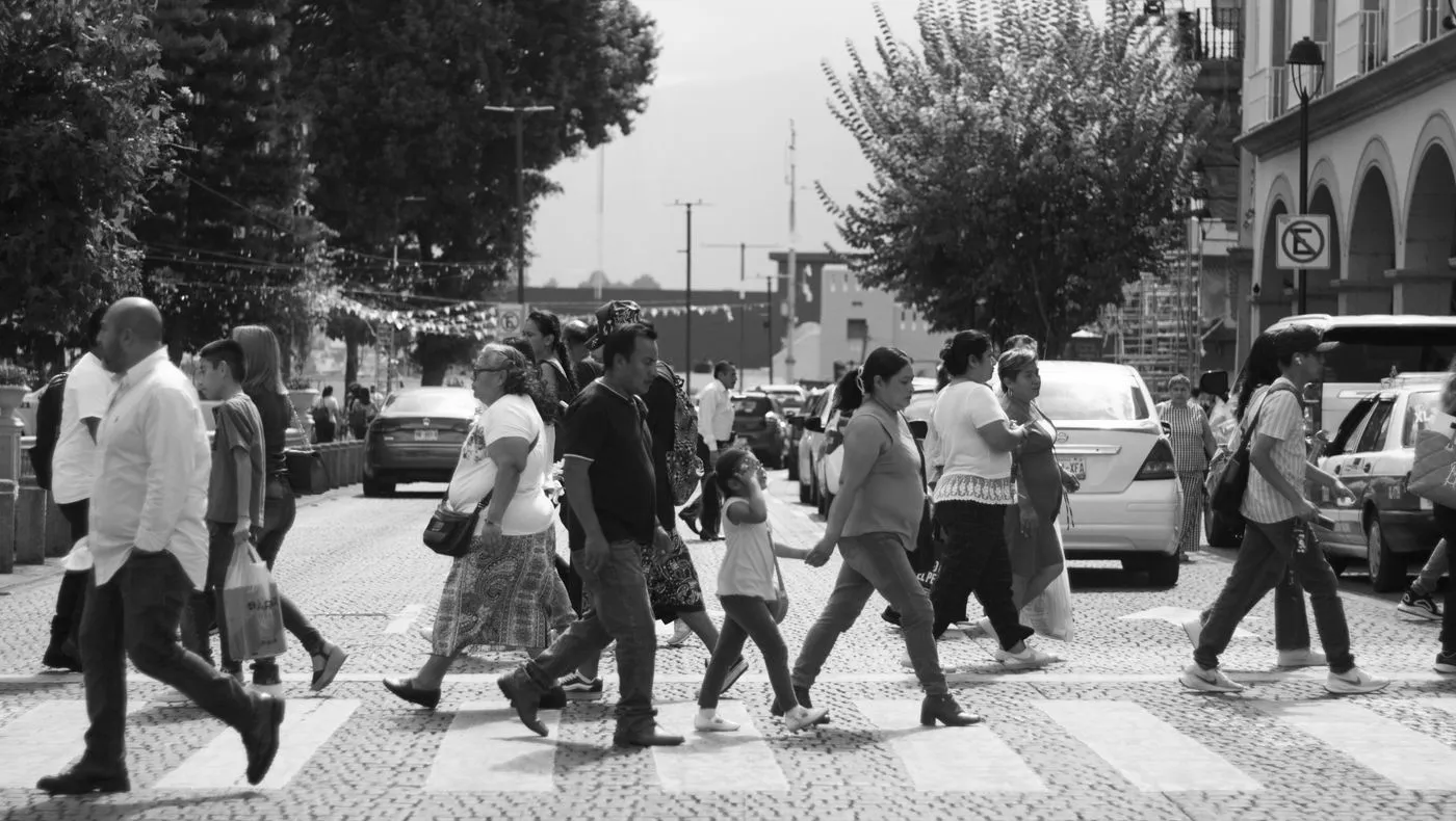 People crossing a busy street