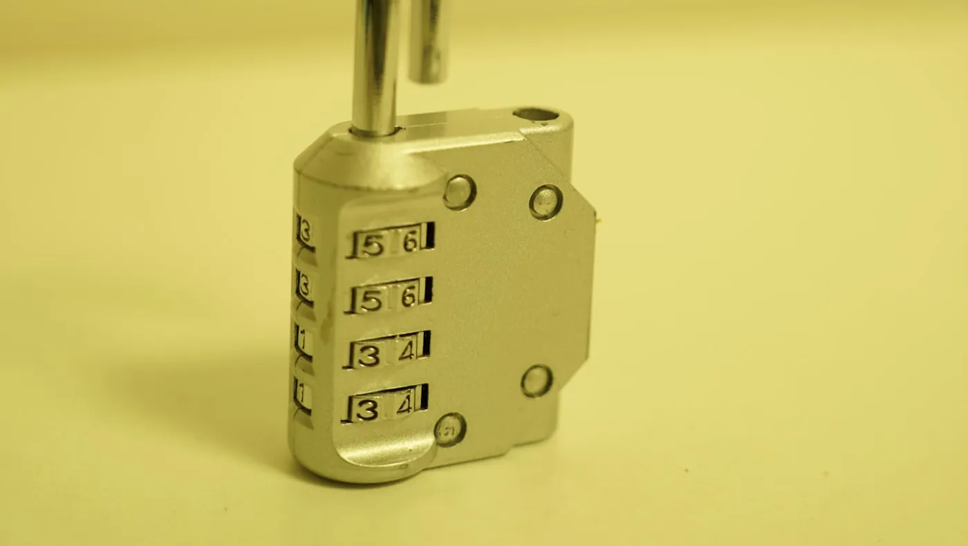 A closed padlock against a plain background