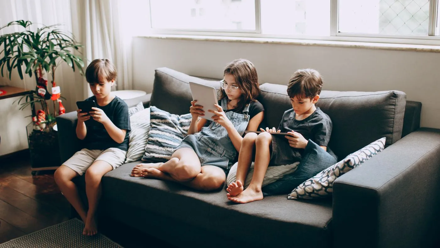 Several people using devices in the same room