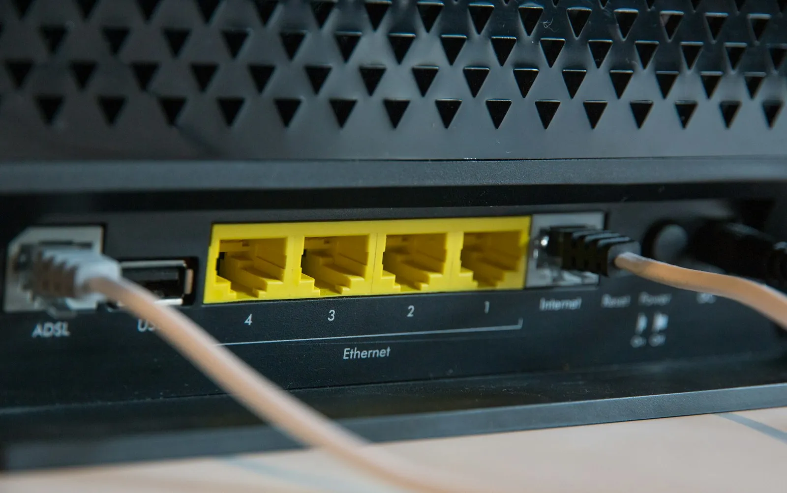 A home router with cables plugged in
