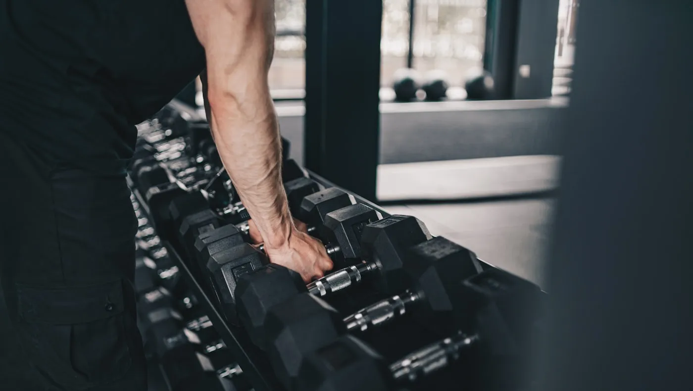 A pair of dumbbells racked in a gym